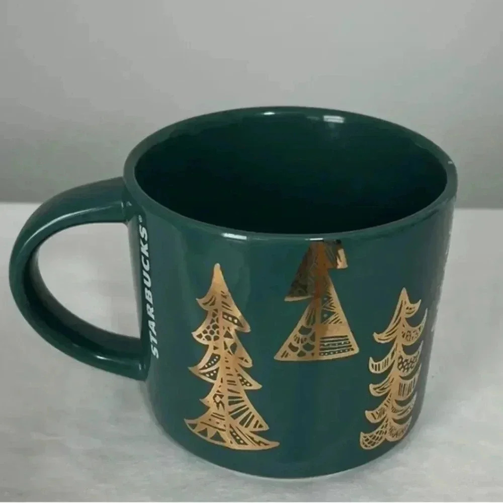 Starbucks A pair of 2015 Winter Green Christmas Cup Mugs With Gold Pinetrees